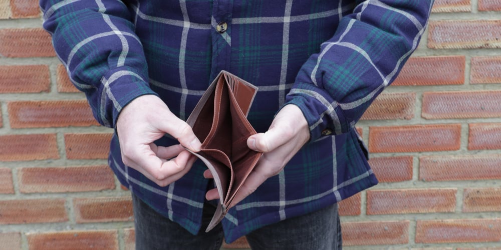 Person opening an empty wallet