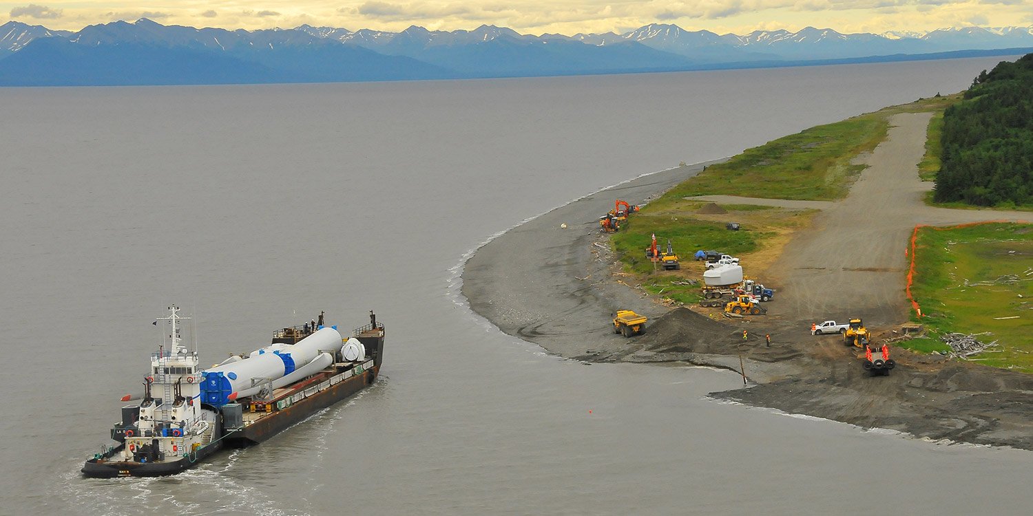 Ferry pulling up to Fire Island to unload wind turbine components
