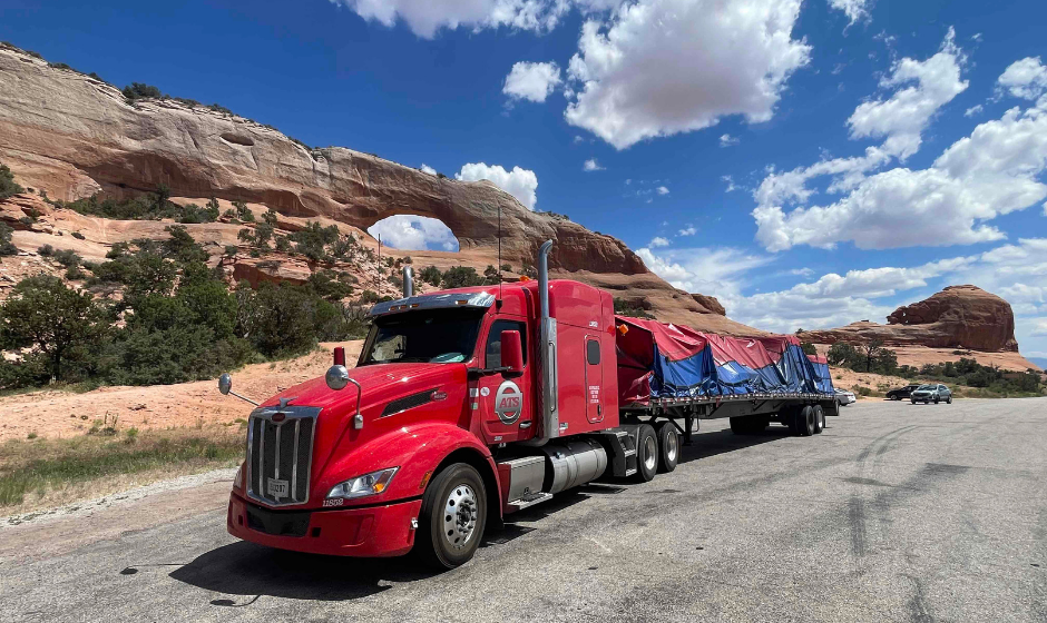 An ATS flatbed truck carrying cargo
