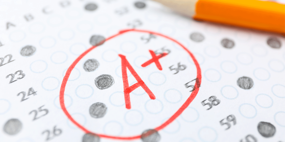 A+ written and circled in red on a filled in test sheet.