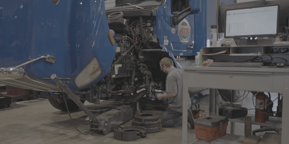 ATS mechanic working on an engine.
