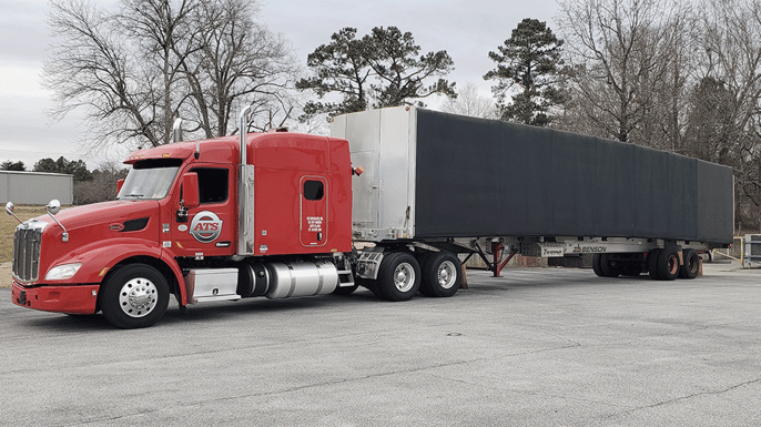 Conestoga-trailer-loaded-with-freight