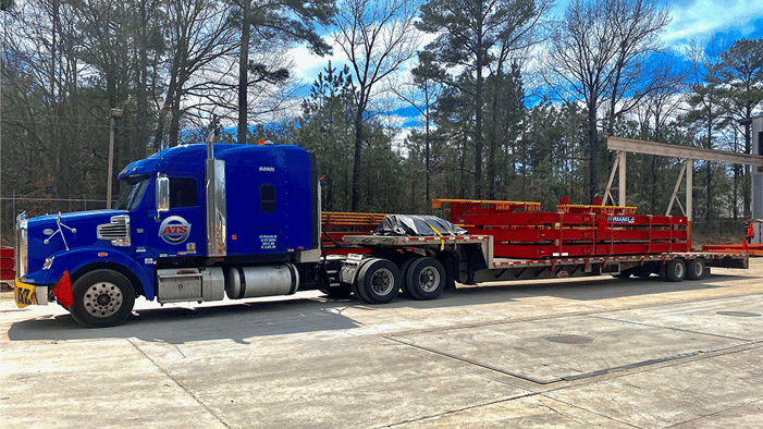 Step-deck-trailer-hauling-beams