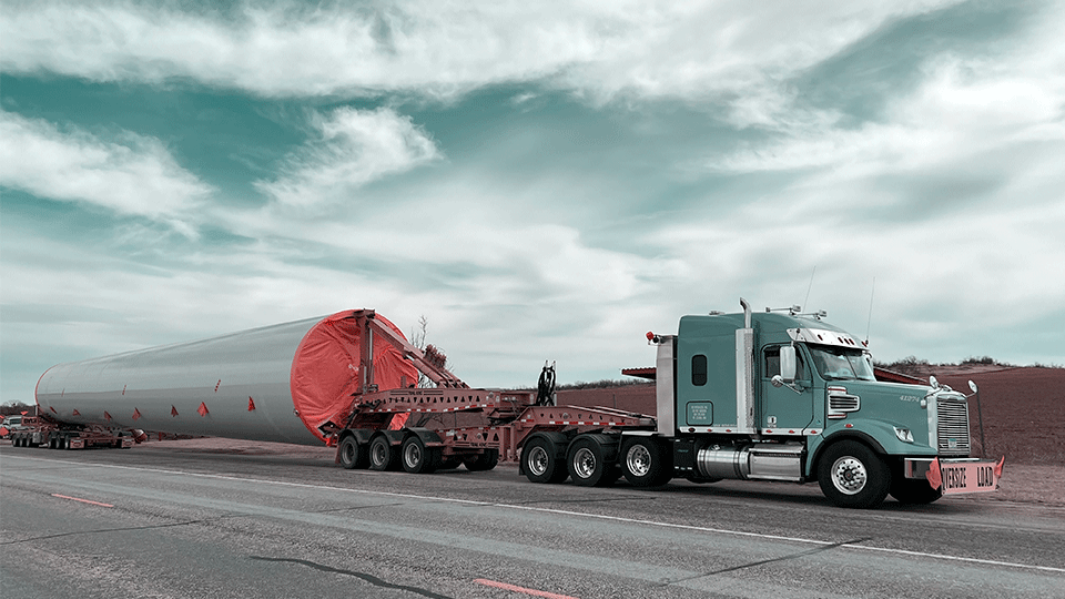 Wind-Turbine-Tower-Behind-Semi-Truck