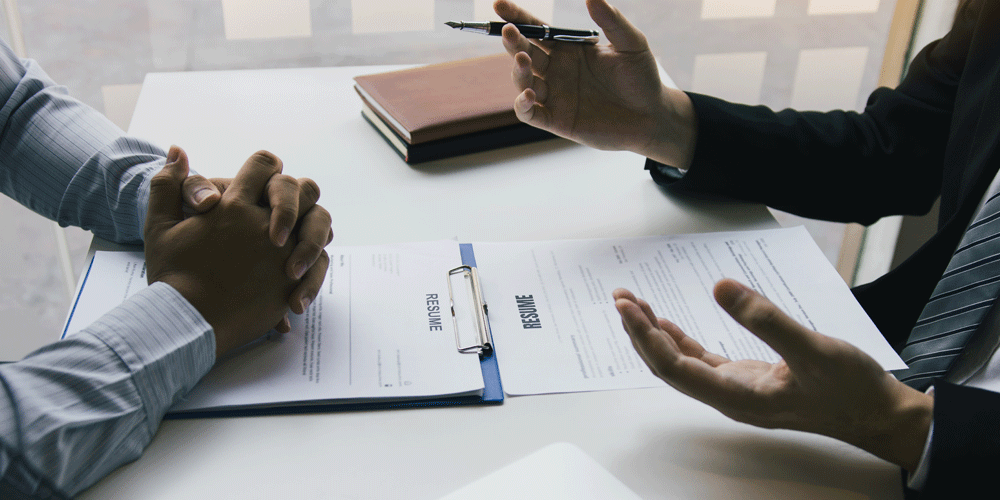 Two-people-looking-at-resume