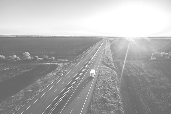 Semi truck driving down the highway