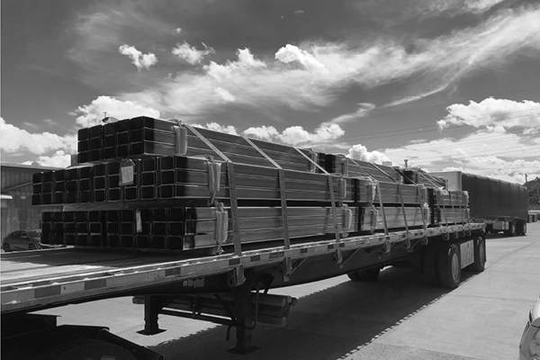 flatbed-hauling-steel-tubbing