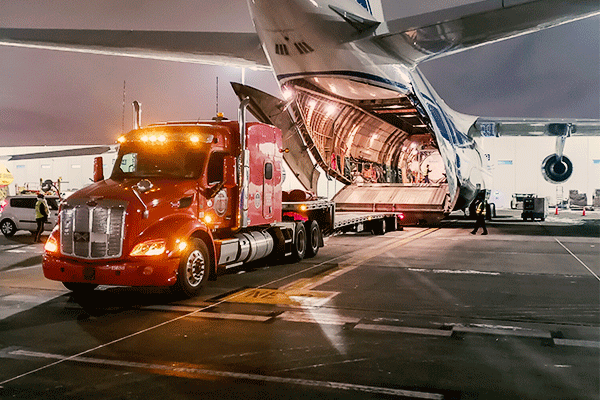 step-deck-trailer-air-strip-unloading-plane